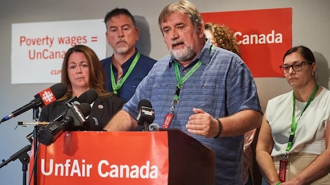 Air Canada staff representatives holding a press conference.