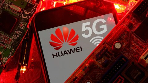The EU flag and a smartphone with the Huawei and 5G network logo are seen on a PC motherboard in this illustration taken January 29, 2020. 