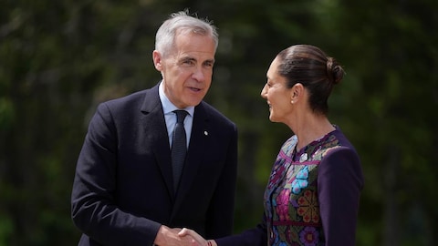 Mark Carney and Claudia Sheinbaum shaking hands.