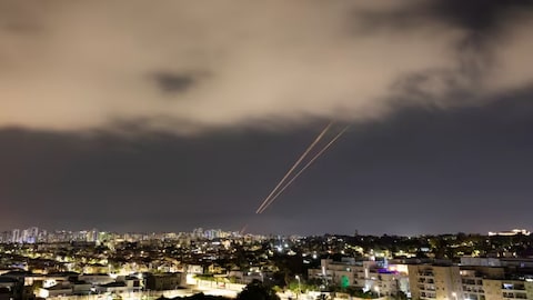 Objects are intercepted in the sky after Iran launched drones and missiles toward Israel, as seen from Ashkelon, Israel April 14, 2024. 