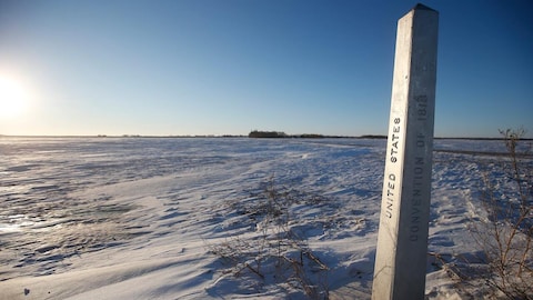 A border marker near Emerson, Man., where four people — including a baby and a teen — died in 2022 trying to cross into the United States. Advocates for refugees fear efforts to cut down on crossings away from border stations will only make lives more dangerous for people fleeing persecution. 