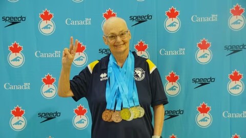 Not letting cancer stop her, Lina Courtois competed at the Canadian Masters Swimming Championships and Canadian Artistic Swimming Championships in Calgary. She took home three gold medals. (Submitted by Lina Courtois.)