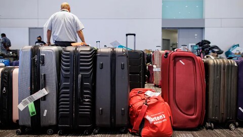 Travellers move through Toronto’s Pearson airport on Thursday. Amid the other problems hitting Canadian airports, more travellers are now complaining about missing baggage, which sometimes fails to arrive during their trip. (Evan Mitsui/CBC)