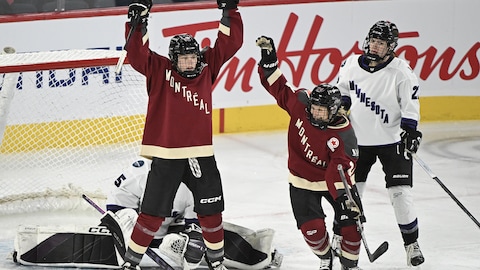 Montreal's Claire Dalton (42) reacts after scoring against Minnesota goaltender Maddie Rooney as Montreal's Ann-Sophie Bettez (24) and Minnesota's Natalie Buchbinder (22) look on during first period PWHL hockey action in Laval, Que., Sunday, Feb. 18, 2024. THE CANADIAN PRESS/Graham Hughes