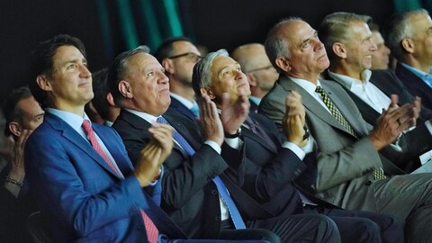 Prime Minister Justin Trudeau makes an announcement about electric vehicles with Quebec Premier François Legault.