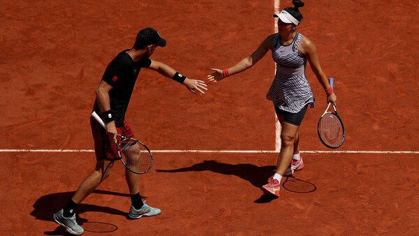 Michael Venus célèbre un point avec Bianca Andreescu.