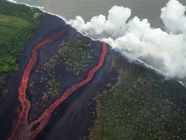 PAHOA, HI - MAY 21: Steam plumes rise as lava enters the Pacific Ocean, after flowing to the water from a Kilauea volcano fissure, on Hawaii's Big Island on May 21, 2018 near Pahoa, Hawaii. Officials are concerned that 'laze', a dangerous product produced when hot lava hits cool ocean water, will affect residents. Laze, a word combination of lava and haze, contains hydrochloric acid steam along with volcanic glass particles. (Photo by Mario Tama/Getty Images) PAHOA, HI - MAY 21: Steam plumes rise as lava enters the Pacific Ocean, after flowing to the water from a Kilauea volcano fissure, on Hawaii's Big Island on May 21, 2018 near Pahoa, Hawaii. Officials are concerned that 'laze', a dangerous product produced when hot lava hits cool ocean water, will affect residents. Laze, a word combination of lava and haze, contains hydrochloric acid steam along with volcanic glass particles. (Photo by Mario Tama/Getty Images)