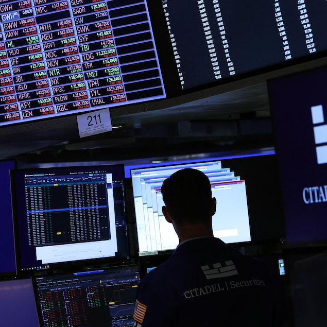 Traders work on the floor of the New York Stock Exchange (NYSE) at the opening bell on April 9, 2025, in New York City. Wall Street stocks were mixed in early trading Wednesday as markets digested the latest tariff hike by the United States and retaliatory moves by China and the European Union. (Photo by TIMOTHY A. CLARY / AFP) (Photo by TIMOTHY A. CLARY/AFP via Getty Images)