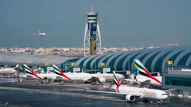 Dubai-based Emirates announced it would halt flights to Boston, Chicago, Dallas-Fort Worth, Houston, Miami, Newark, New Jersey, Orlando, San Francisco and Seattle. Above, an Emirates jetliner comes in for landing at the Dubai International Airport in December 2019.