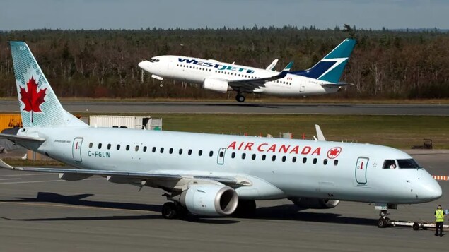 Air Canada and WestJet have set out to appeal separate Canadian Transportation Agency decisions involving compensation awarded to passengers for flight cancellations caused by crew shortages. (Andrew Vaughan/The Canadian Press)