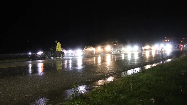 Emergency crews direct traffic through Abbotsford, B.C., after intense flooding closed a number of major highways in southern B.C. on Sunday. 