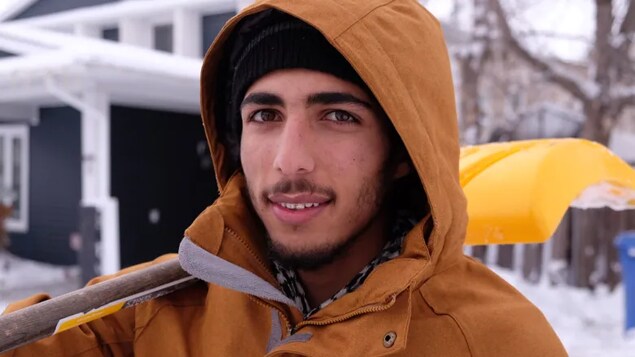 Abdullah Alhassan,19, came to Canada as a refugee from Syria five years ago. He's been shovelling driveways to help save money for university. 
