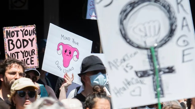 People in Montreal take part in a protest on Sunday to denounce the U.S. Supreme Court's decision to overturn the law that provided the constitutional right to abortion for almost 50 years. (Graham Hughes/The Canadian Press)