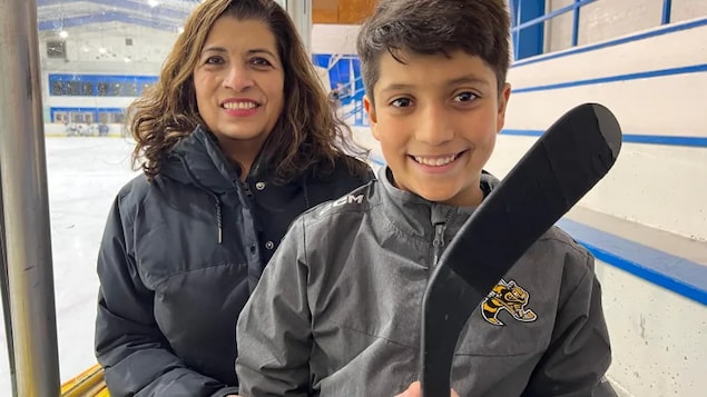Adriana Mendoza says it's wrong her 10-year-old son Mark Donkers has to apply for a transfer from his home country to play hockey in Canada because he was not born in Canada. (Andrew Lupton/CBC News)