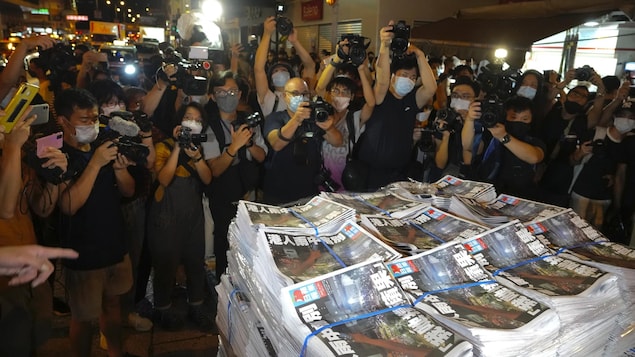 FILE - Copies of the last issue of Apple Daily arrive at a newspaper booth in Hong Kong on June 24, 2021. When the British handed its colony Hong Kong to Beijing in 1997, it was promised 50 years of self-government and freedoms of assembly, speech and press that are not allowed Chinese on the Communist-ruled mainland. As the city of 7.4 million people marks 25 years under Beijing's rule on Friday, those promises are wearing thin. Hong Kong's honeymoon period, when it carried on much as it alway