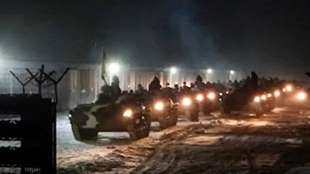 Belarusian military vehicles gather preparing to attend Belarusian and Russian joint military drills in Belarus on Tuesday, Jan. 25, 2022. Russia has sent an unspecified number of troops from the country's far east to its ally Belarus, which shares a border with Ukraine, for major war games next month. (Vayar Military Agency Agency via AP)
