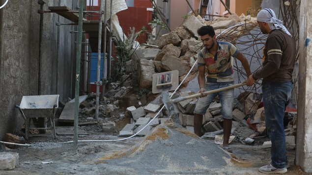 BEIRUT, LEBANON - AUGUST 03: Ongoing construction work and daily life in the Karantina neighbourhood closest to the port and badly damaged during the blast on August 03, 2021 in Beirut, Lebanon. A year after the gigantic explosion at the port of Beirut, the investigations and rebuilding by the Lebanese government have not advanced whilst one in three families in Lebanon has children still showing signs of trauma, the United Nations Children's Fund (Unicef) said on Tuesday (August 3rd). (Photo b