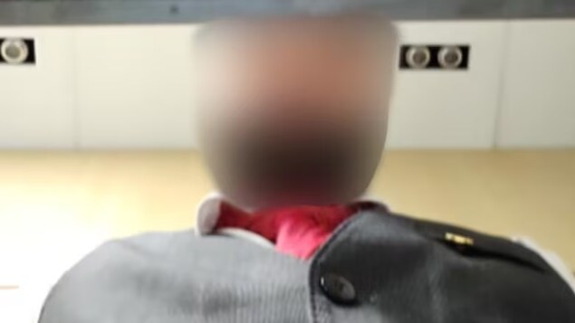 This Air Canada employee was photographed by a security app after trying to unlock a phone that had been left behind at Toronto's Pearson International Airport. CBC News obscured his face to protect his identity. 