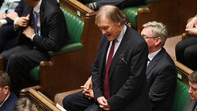 British MP Sir David Amess, seen at a Prime Minister's Questions session in 2020, was stabbed several times, local reports say. (Jessica Taylor/U.K. Parliament/Reuters)