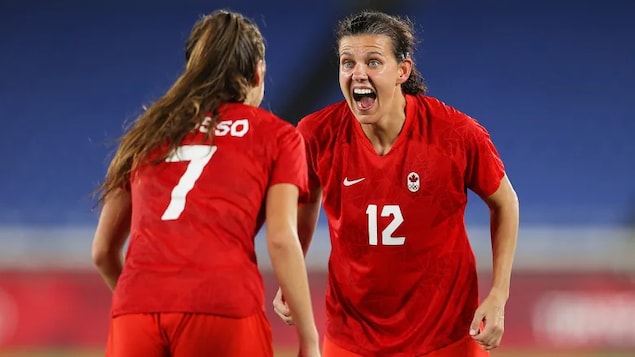 Canadian Christine Sinclair, right, celebrates Canada’s gold-medal victory over Sweden with teammate Julia Grosso Friday in Tokyo. 