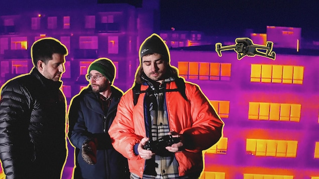 Trois hommes regardent une image thermique de la ville.