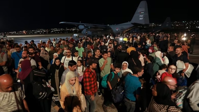 Jordanians evacuated from Sudan arrive at a military airport in Amman, Jordan on April 24, 2023. (Raad Adayleh/AP)