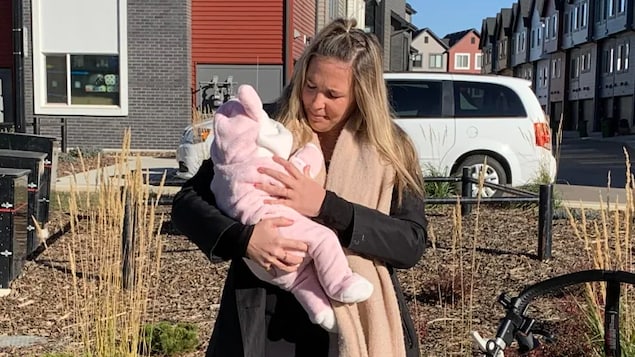 Cheryl Franko holds six-week-old Emmylou outside of her home in Edmonton.