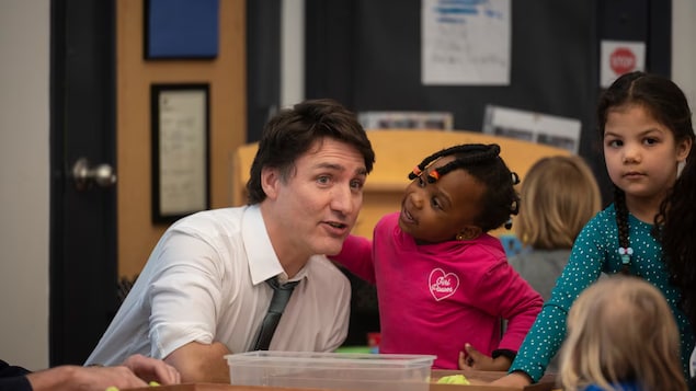 Prime Minister Justin Trudeau chats with children at a child care facility at the Don Christian Recreation Centre in Surrey, B.C. on Thursday, March 28, 2024. 