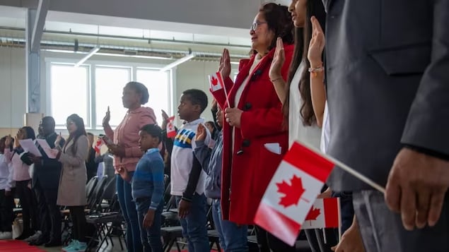 New Canadians take the oath of citizenship in Brandon, Manitoba on Thursday, Oct. 26, 2023. (Chelsea Kemp/CBC)