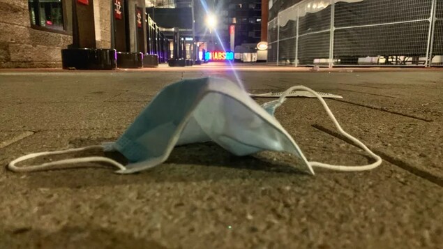 Mask on the sidewalk.