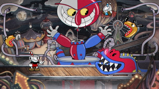 Une capture d'écran du jeu vidéo Cuphead montrant le petit personnage en train de combattre le train d'une montagne russe en forme de crocodile. Une capture d'écran du jeu vidéo Cuphead montrant le petit personnage en train de combattre le train d'une montagne russe en forme de crocodile.
