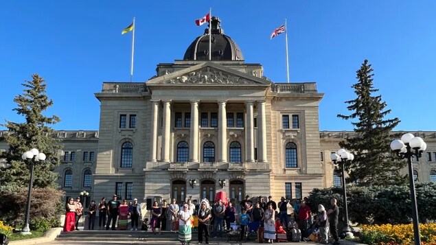 Supporters for Dawn Walker gather at the legislature in Regina on Tuesday to issue calls for Walker to be extradited back to Canada from the U.S. (Adam Bent/CBC)