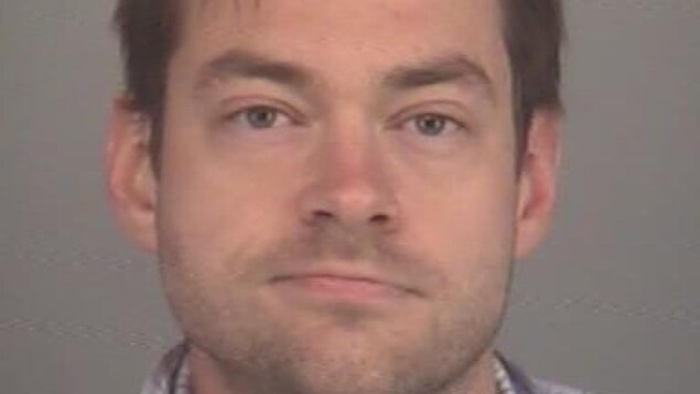 La photo de Dellen Millard, alors qu'il avait 30 ans, prise par la police après son arrestation le 11 mai 2013.