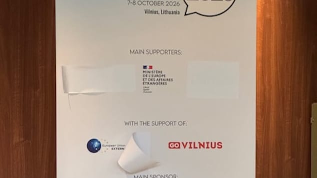 The government of Canada logo was covered up on signs spotted around the anti-disinformation conference. 
