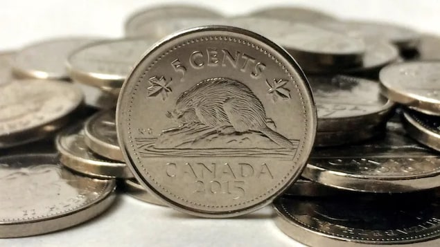 An internal federal analysis shows the government has studied the pros and cons of the nickel — but Ottawa insists it has no plans to force the five-cent coin into retirement, as it did the penny. When the Royal Canadian Mint yanked the penny from circulation in 2013, the nickel became the country's smallest circulating denomination of pocket change. (Graeme Roy/The Canadian Press)