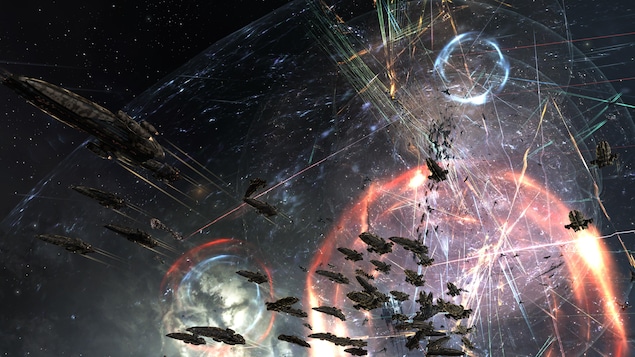 Une capture d'écran du jeu EVE Online montrant une bataille à grand déploiement entre des milliers de vaisseaux spatiaux. Une capture d'écran du jeu EVE Online montrant une bataille à grand déploiement entre des milliers de vaisseaux spatiaux.