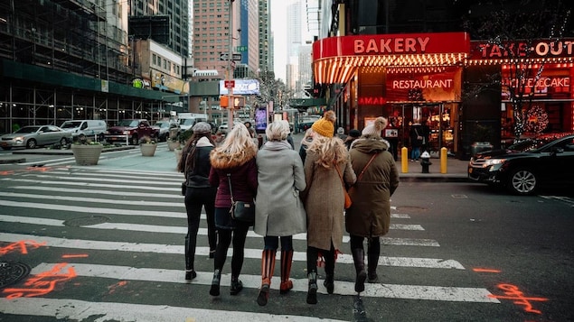 A group of women walking down a road in New York City in 2019.