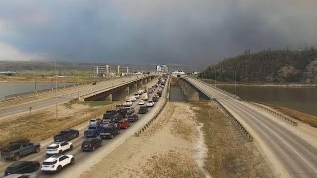 A highway camera photo shows traffic in Fort McMurray jammed in the southbound lane of Highway 63 on the north side of the Athabasca River. The image was captured at 3:11 p.m. MT Tuesday, about an hour after an evacuation order was issued for four neighbourhoods.