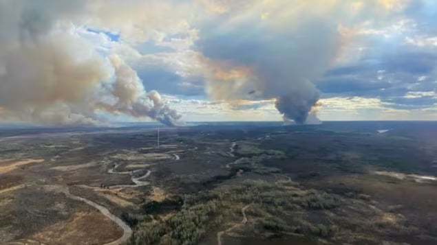 The wildfire threatening Fort McMurray grew rapidly on Monday, fueled by shifting winds. 