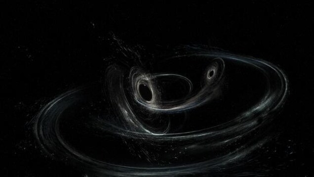 Représentation artistique montrant la fusion de deux trous noirs produisant des ondes gravitationnelles. Représentation artistique montrant la fusion de deux trous noirs produisant des ondes gravitationnelles.