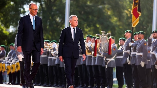German Chancellor Friedrich Merz receives Canadian Prime Minister Mark Carney at the chancellery in Berlin on Tuesday. 