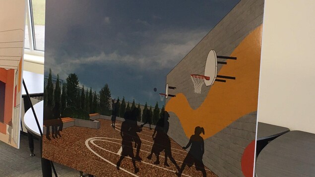 Un dessin montrant une cour d'école sur un toit Un dessin montrant une cour d'école sur un toit