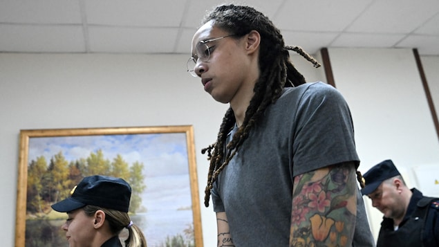 WNBA star and two-time Olympic gold medallist Brittney Griner is escorted from a courtroom in Moscow on Aug. 4. On Thursday, the U.S. announced that she had been freed as part of a U.S.-Russia prisoner swap. (Alexander Zemlianichenko/The Associated Press)