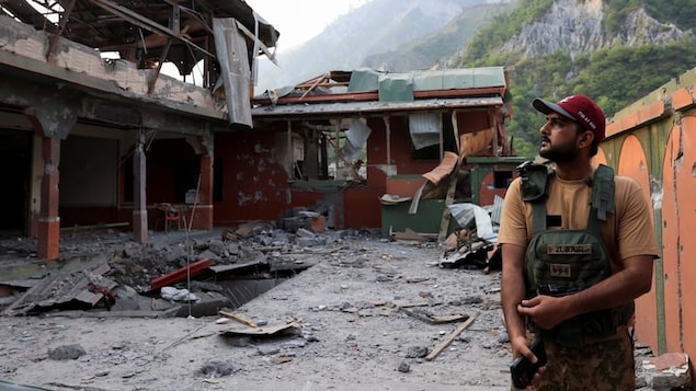 A Pakistan Army soldier stands at the premises of the Bilal Mosque, after it was hit by an Indian strike in Muzaffarabad, the capital of Pakistan-administered Kashmir, Wednesday. The escalating violence between India and Pakistan is a major resurgence in the fight over the long-disputed region of Kashmir. 