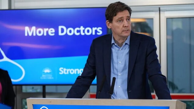 Premier David Eby speaks during an announcement about the expansion of a program that helps internationally educated doctors obtain a licence to practice in the B.C. on Sunday, November 27, 2022. (Darryl Dyck/The Canadian Press)