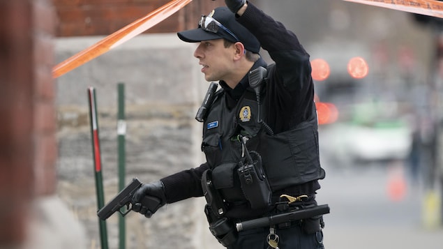 Police officer holding a gun