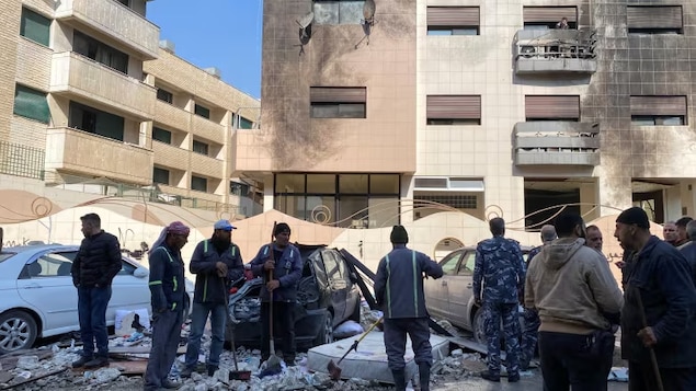 Damage is shown near a residential building in the Kafr Sousa district of Damascus on Feb. 21 from an Israeli airstrike. There have been periodic Israeli attacks on Hezbollah targets and in Syria since the Oct. 7 attacks in southern Israel, but Friday's incident was the deadliest. 