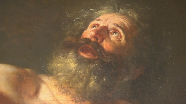 Sur le tableau, Saint Jérôme, portant la barbe, regarde vers le ciel.