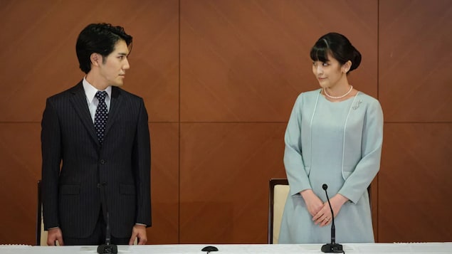 Japan's former princess Mako, right, the elder daughter of Prince Akishino and Princess Kiko, and her husband Kei Komuro, whom she originally met while at university, pose at the start of a news conference to announce their marriage registration, at the Grand Arc Hotel in Tokyo.