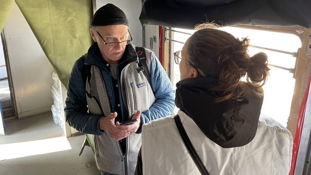 Dr.  Jean-Clément Cabrol discusses with a member of his team. 